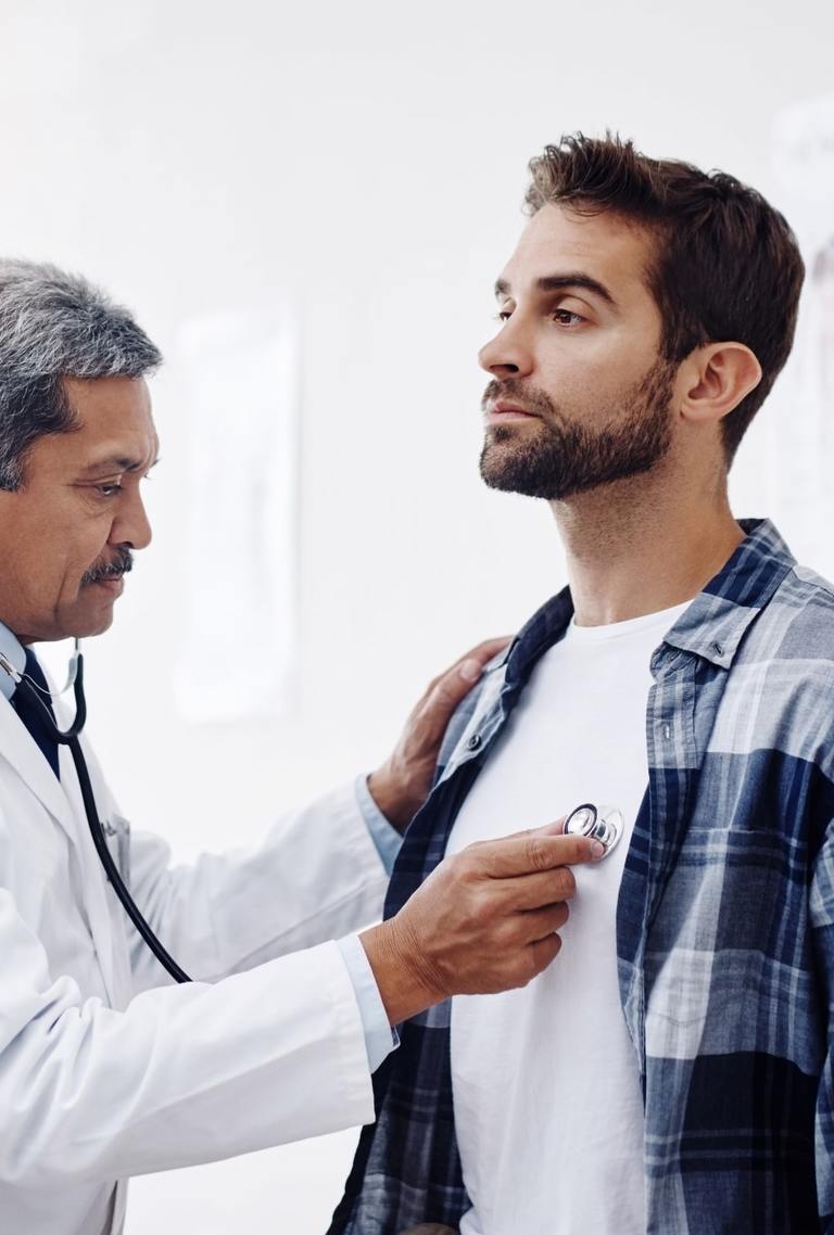 A Doctor Examining A Man's Health Condition For A Healthy Heart