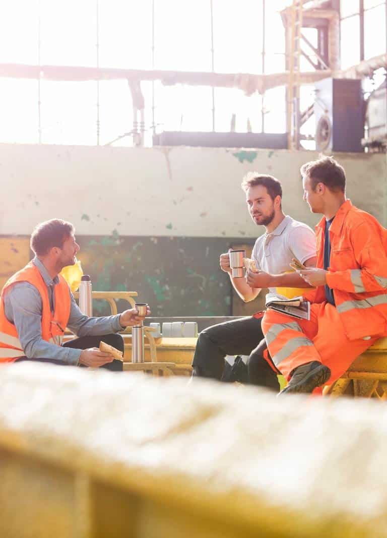 Three Men Having A Discussion While Enjoying Their Food For Gut Health